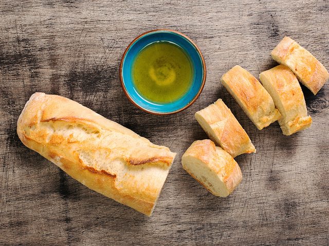 Cooking oil and French baguette bread for dipping