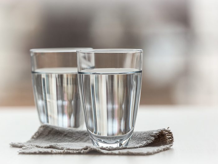 Health myth, two glasses of water side by side on a counter