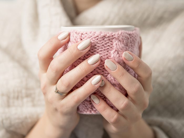Health myth, A woman with pretty pink nails holds a coffee mug