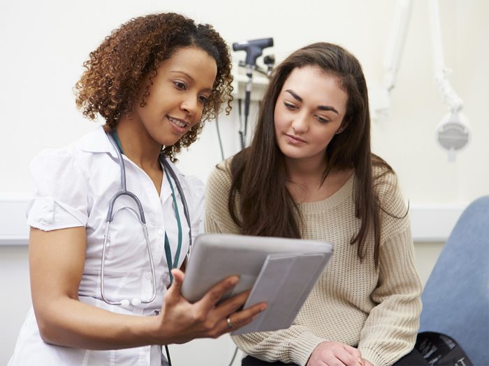 Health myth, A young woman checks her results with a doctor or nurse