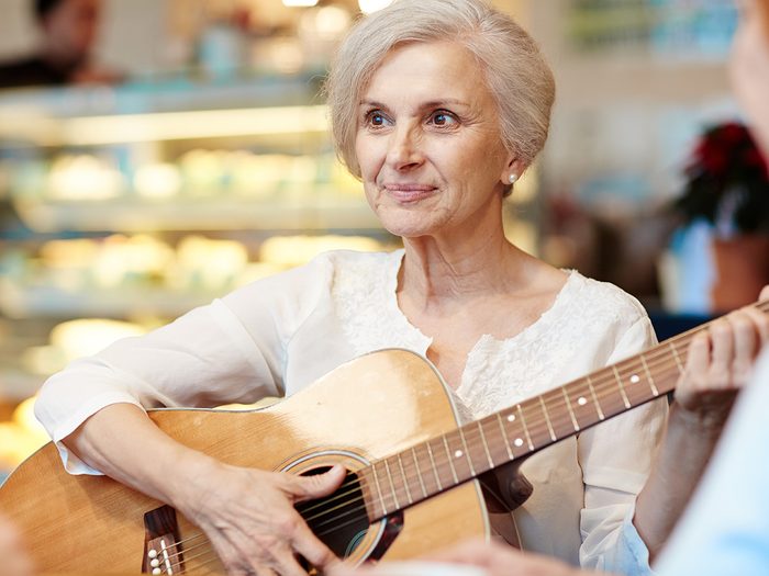 How to improve memory, Elderly woman plays guitar