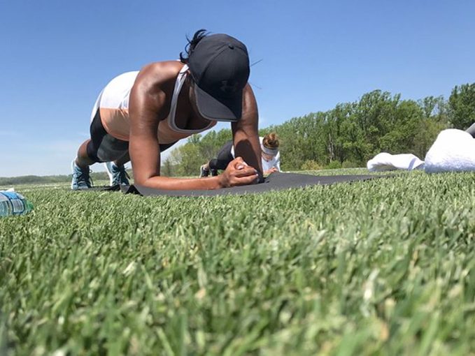 Michelle Obama does a plank outdoors