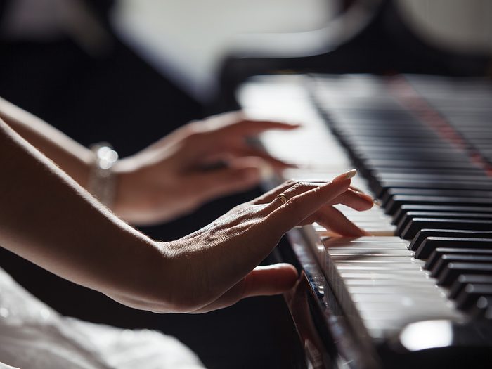 Rainy mood, woman's hands playing piano