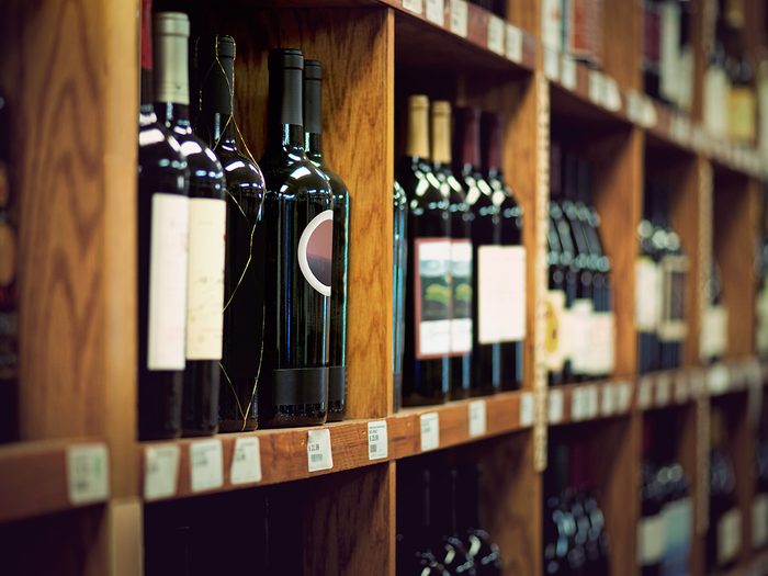 Wine on wooden shelves at store