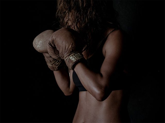 Halle Berry with her boxing gloves up ready to box