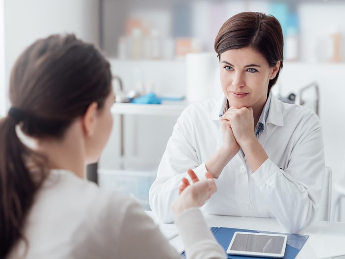 A woman consults her doctor about heartburn