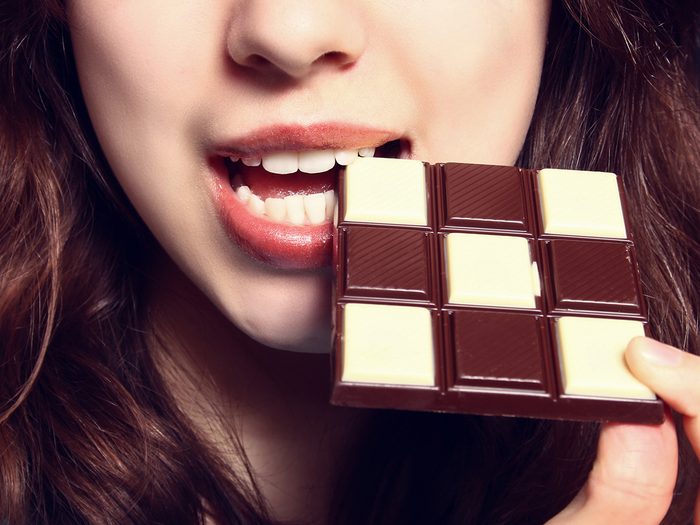 Intelligence, woman eating chocolate