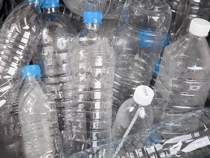 Cancer, empty plastic water bottles in a heap