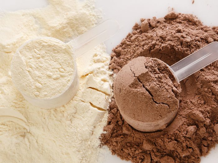 Healthy foods, scoops of vanilla and chocolate protein powder