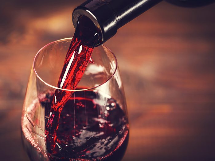 Healthy foods, a wine glass being filled with red wine
