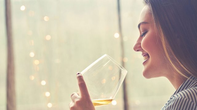 Energy, woman drinking a glass of wine