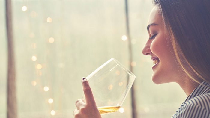Energy, woman drinking a glass of wine