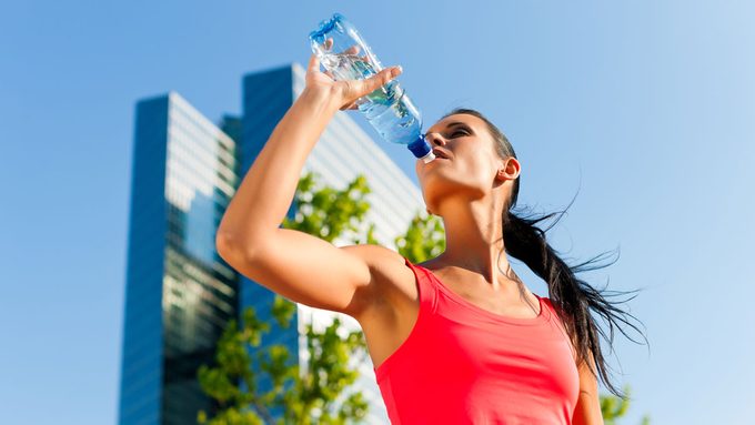 Woman drinking water for health