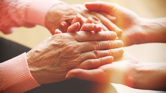 Caregiver Stress, women holding hands