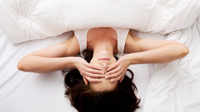 How Sugar Affects Sleep, woman lying in bed