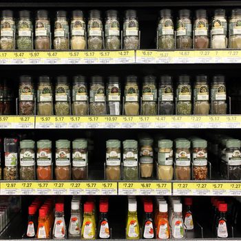 Various spices and seasoning powders on shelves in a supermarket. McCormick is one of the main manufactures spices, herbs, and flavorings in the world.