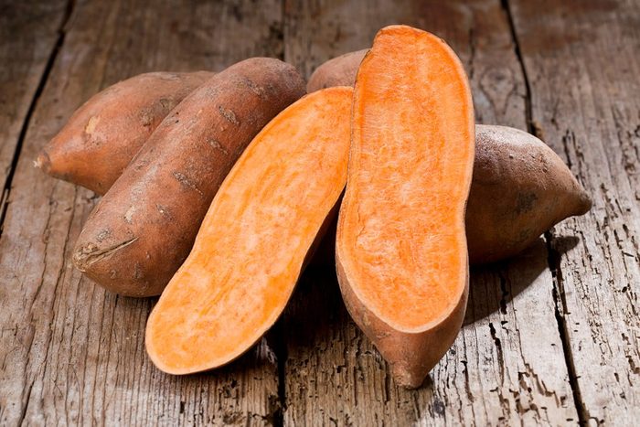 Sweet potato on Wooden background 