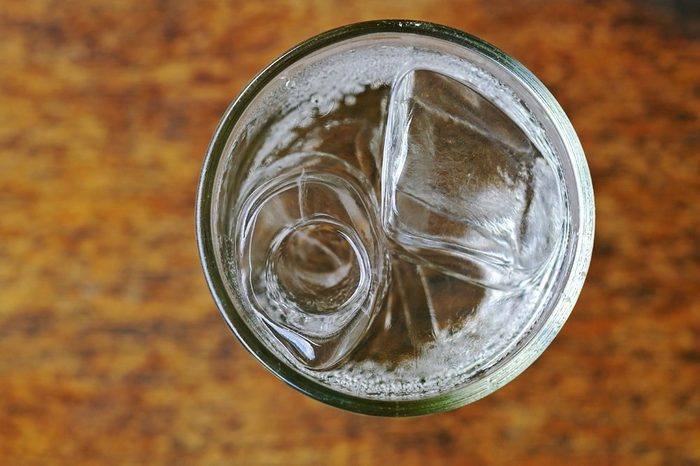 soda with water and ice in the glass cup; top view