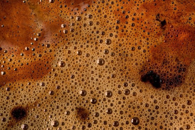 Coffee foam extreme close up. Macro texture and background