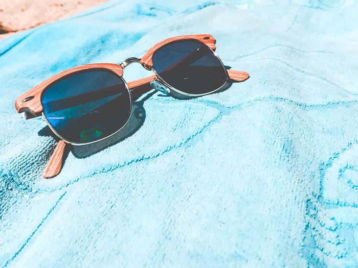 beach towel and sunglasses