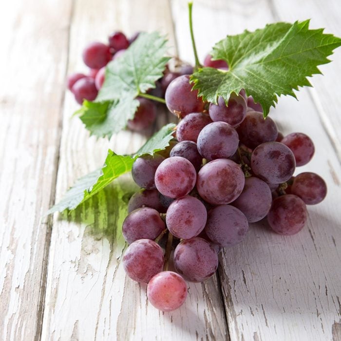 Grapes on wooden table, close-up.; Shutterstock ID 216882460; Job (TFH, TOH, RD, BNB, CWM, CM): Taste of Home