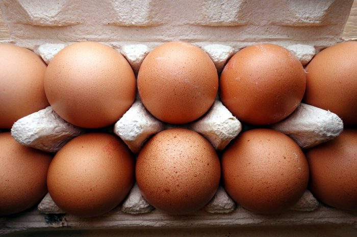Organic eggs in a box, overhead view