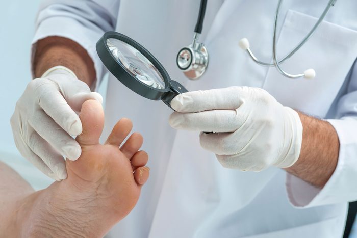 doctor examining a patient's foot