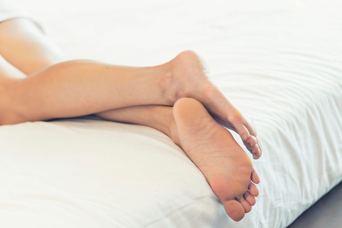 person lying down, close up of backs legs and feet