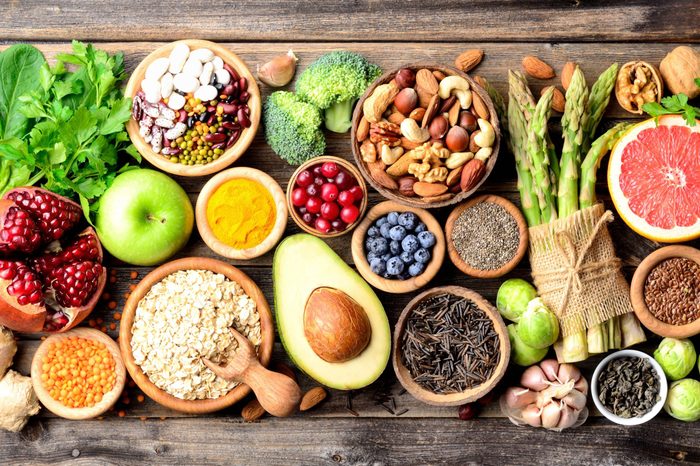 Superfoods, vegetables, fruits, seeds, legumes, nuts and grains for vegan and vegetarian eating. Clean eating. Detox, dieting food concept. Top view .