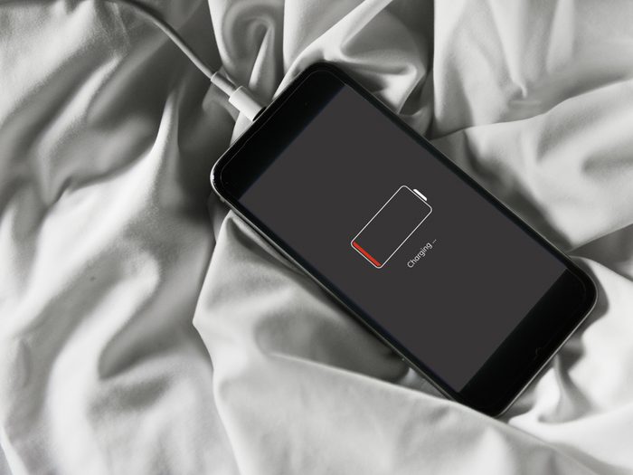 charging a phone in bed