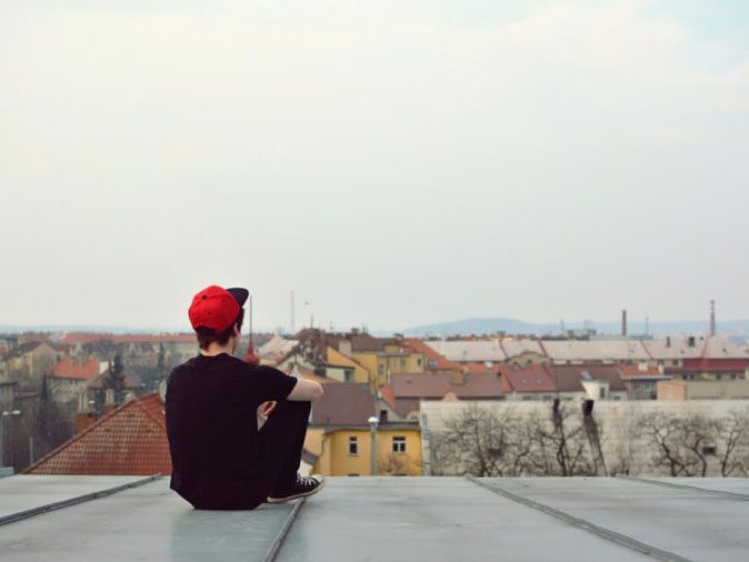 men domestic violence - man sitting on roof