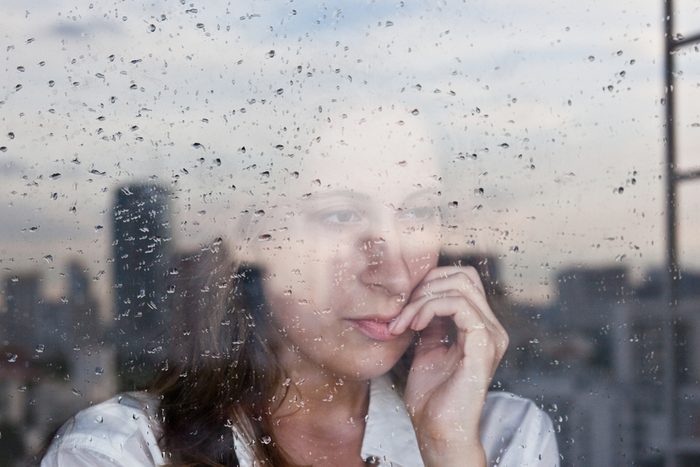 early-onset Alzheimer's | Melancholy reflection of the girl in the window