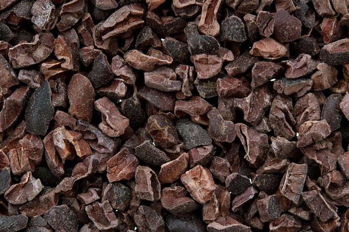 Cacao nibs isolated on white background