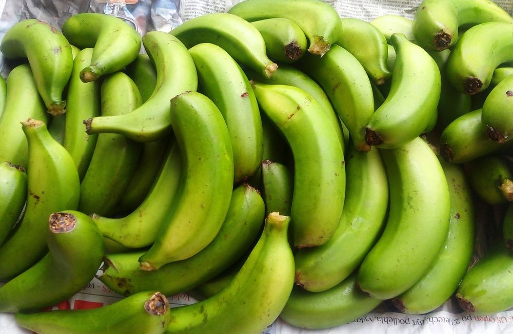 Close-up of unripe green bananas on table