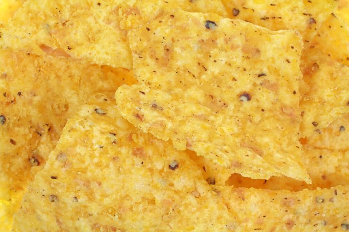 A close view of traditional yellow corn tortilla chips.