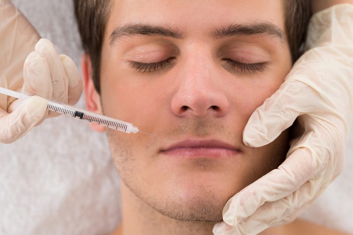 Anti-Aging Treatments | Close-up Of Doctor In Glove Giving Injection On Face Of Man In Clinic