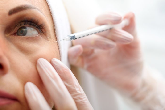 Anti-Aging Treatments | Professional beautician making botox facial injection