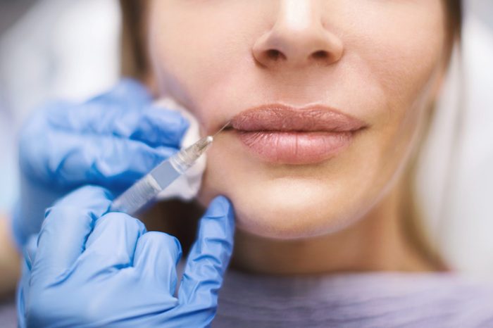 woman lips skin injection botox