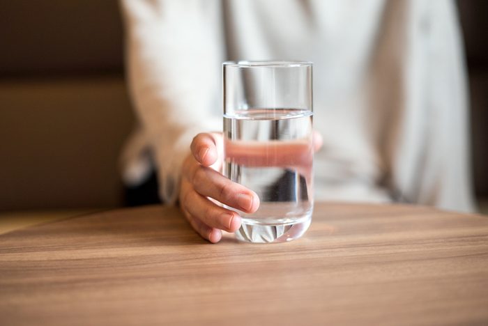 body does overnight | woman holding a glass of the water