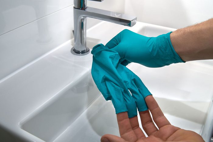 wearing gloves to protect against coronavirus