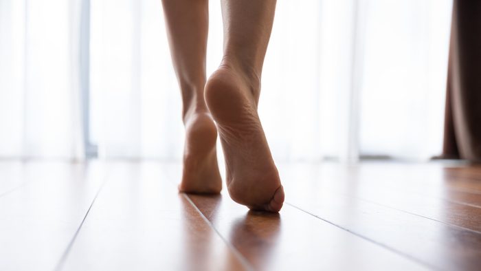 body facts | close up of woman's feet walking in home
