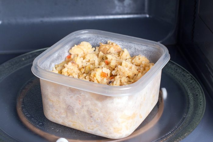 food in plastic container in microwave