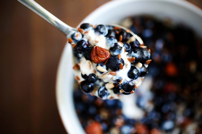 refuel after exercise | yogurt with fruit in spoon