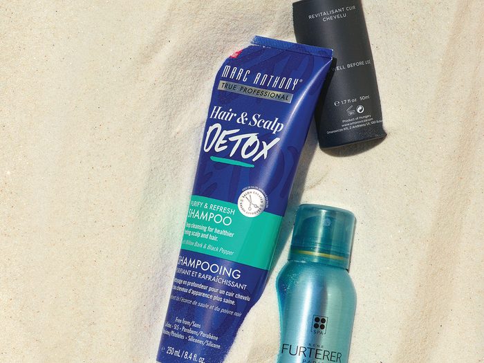 summer beauty products for skin and hair | beauty products in sand
