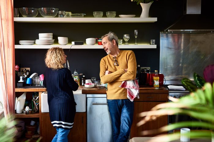 early-onset Alzheimer's | mature couple having a conversation in the kitchen
