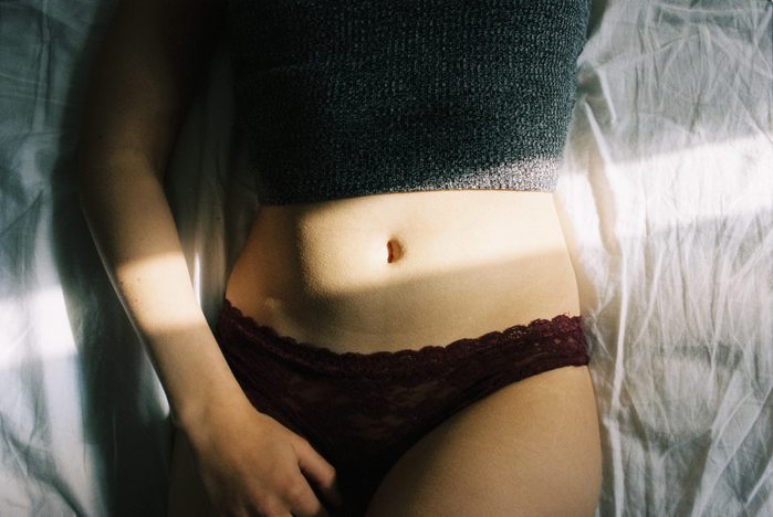 midsection of young woman wearing underwear