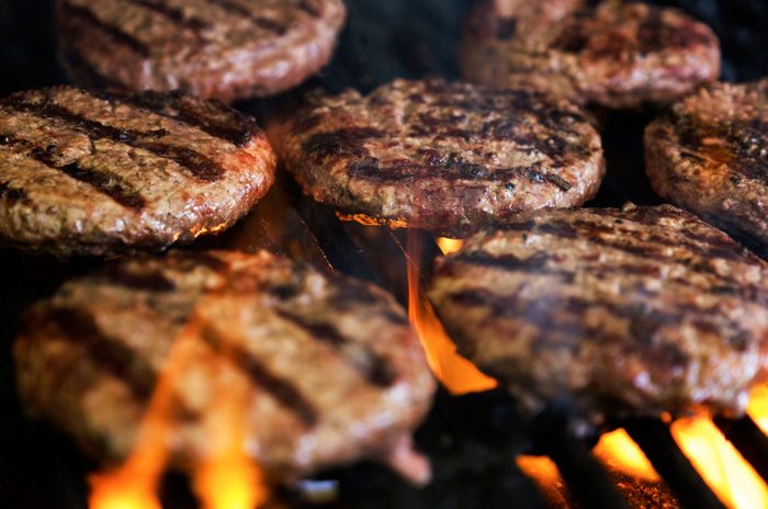 healthier grilling | close up of burger patties on the grill