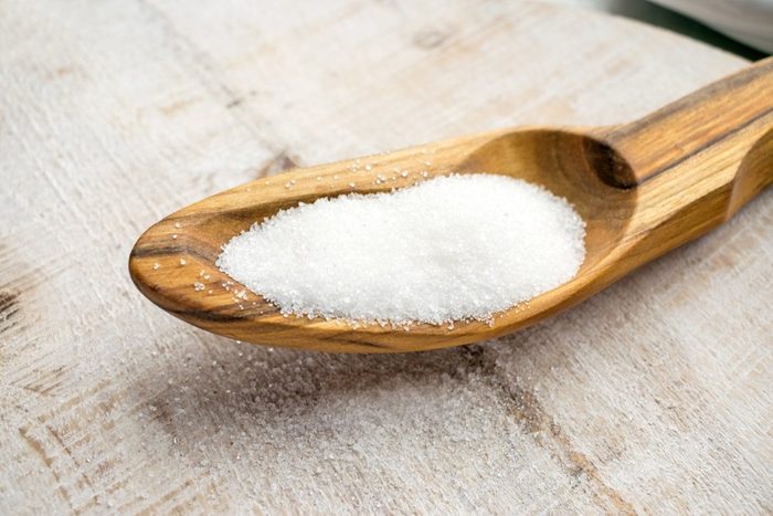 Artificial Sweeteners and Sugar Substitutes in wooden spoon. Natural and synthetic sugarfree food additive: sorbitol, fructose, honey, Sucralose, Aspartame | foods to avoid before workout