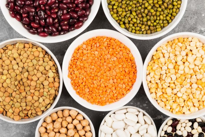 Assortment of beans (red lentil, green lentil, chickpea, peas, red beans, white beans, mix beans, mung bean) on gray background | foods to avoid before workout