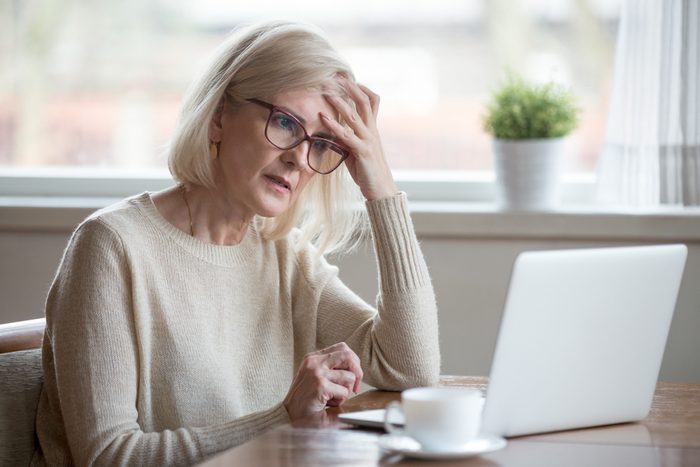 early-onset Alzheimer's | Thoughtful confused mature business woman concerned thinking about online problem looking at laptop, frustrated worried senior middle aged female reading bad email news, suffering from memory loss